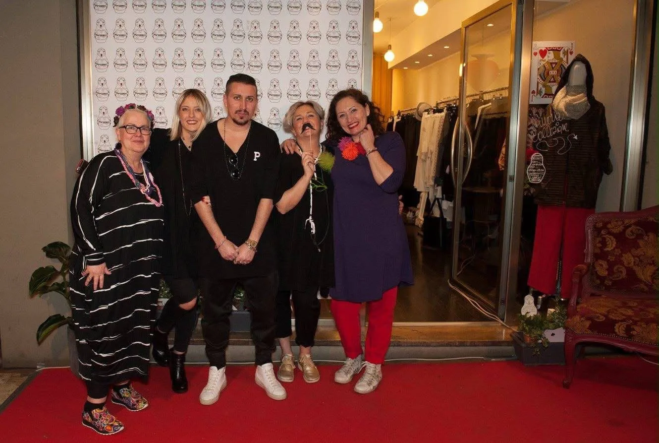 An in-store event in front of the Periodico matryoshka backdrop