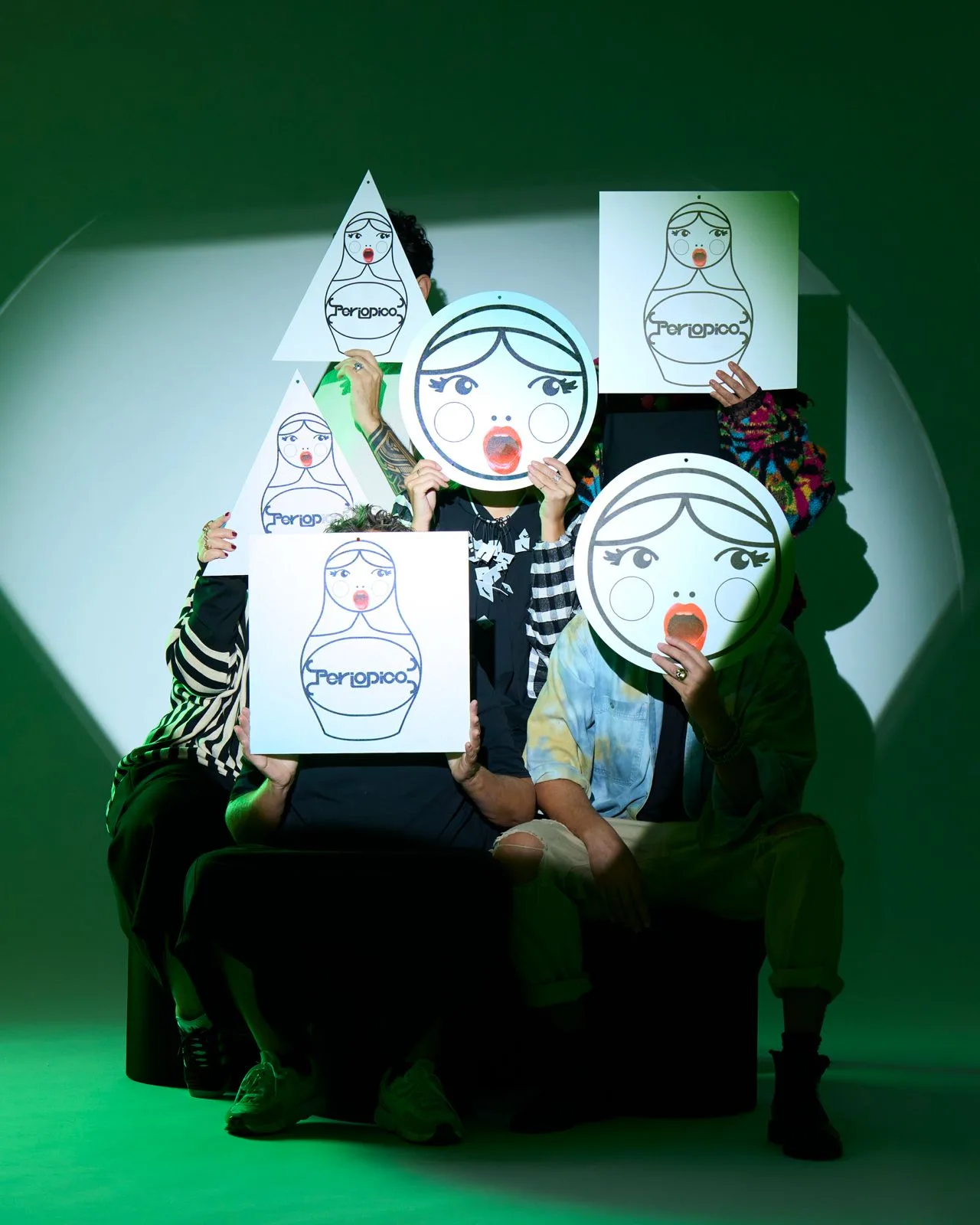 The Periodico family wearing matryoshka masks